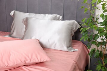 Beautiful silk linens on bed at home