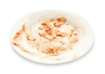 One dirty plate with smeared sauce and pasta isolated on white