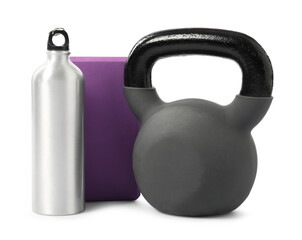 Kettlebell, fitness block and water bottle isolated on white