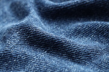 Texture of blue denim fabric as background, closeup