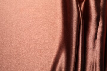 Beautiful crumpled silk fabric as background, top view