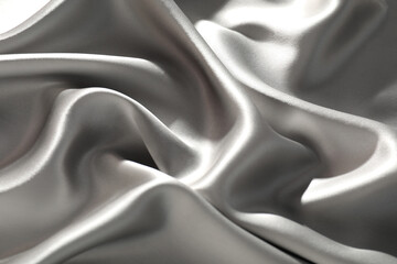 Obraz premium Grey crumpled silk fabric as background, top view