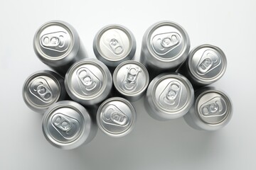 Many different tin cans on light background, top view