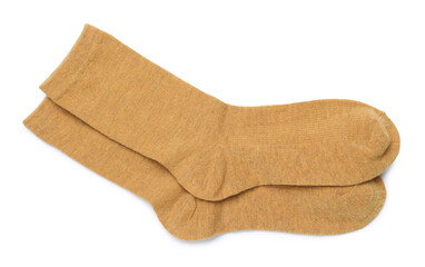 Pair of dark yellow socks isolated on white, top view