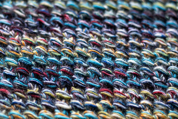 Closeup of vibrant multicolored woven textile with intricate texture and details