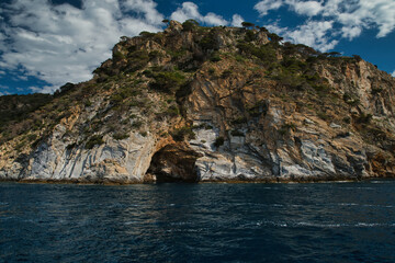 Fototapeta premium Views from a boat of Cap Norfeu and Cap de Creus: Landscape of the cliffs of the Natural Park Cap de Creus, in the Mediterranean in Roses, Alt Emporda. Costa Brava. Catalonia. Spain