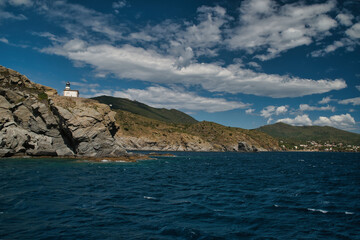 Obraz premium Lighthouse of Cala Nans in Cap de Creus: Landscape of the cliffs of the Natural Park of Cap de Creus, in the Mediterranean in Roses, Alt Emporda,. Costa Brava. Catalonia. Spain 