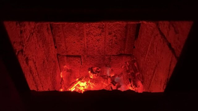 hot coals in the firebox of a home stove