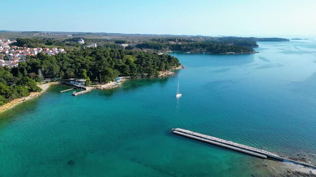 Aerial view of Poreč (Porec), Croatia, showcasing the charming old town, vibrant coastline, and the nearby island of Sveti Nikola. The stunning Zelena Laguna area adds to the beauty turquoise waters