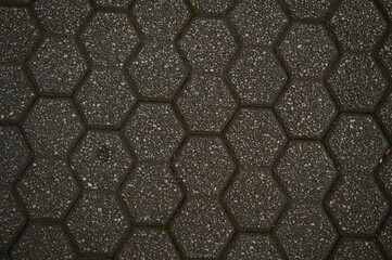 пятиугольна плитка як фон в старому місті, сіра плитка 