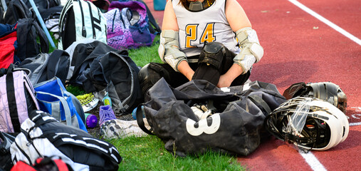 It takes a lot of gear and a lot of time for a girl's lacrosse goalie to get ready to enter the...