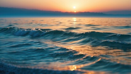 Obraz premium Close-up of a sandy shore with gentle waves lapping