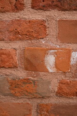 Red brick wall texture. Classic masonry pattern with rough surface. Ideal for architectural backgrounds, vintage design, construction themes, or texture overlays.