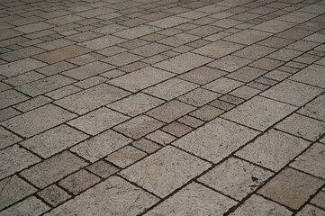 Fototapeta premium grey paving tile texture, grey tile pattern as background, grey tile texture close up 