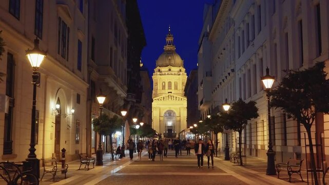 Zrinyi utca street and Saint Stephen`s Basilica in the evening in central Budapest, Hungary. The picturesque pedestrian street Zrinyi Utca with St.Stephen's Square and St.Stephen's Basilica. Editorial