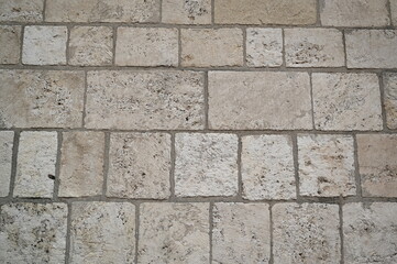 grey natural stone pavement texture, square tiles background for architecture, design, flooring, construction and urban projects