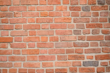 Red brick wall close up background. Vintage masonry texture of red bricks with mortar