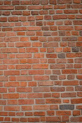 Red brick wall close up background. Vintage masonry texture of red bricks with mortar