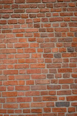 Red brick wall close up background. Vintage masonry texture of red bricks with mortar