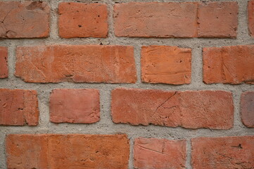 Obraz premium Red brick wall texture with diagonal masonry pattern. Old rustic bricks and mortar close up