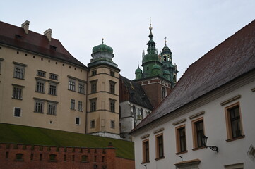 Historic European street with old buildings and church tower. Narrow cobblestone alley with traditional architecture, ideal for travel, tourism, and cultural heritage themes.