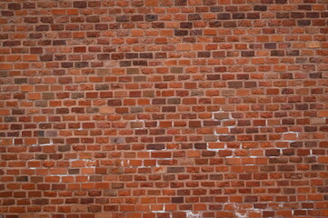 red brick wall texture close-up as background texture of a red brick wall with visible mortar lines...