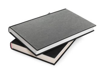 Closed black hardcover books isolated on white