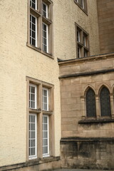 Historic government building entrance in Luxembourg City. Elegant stone doorway with columns and arched wooden door — example of European architecture and civic heritage.