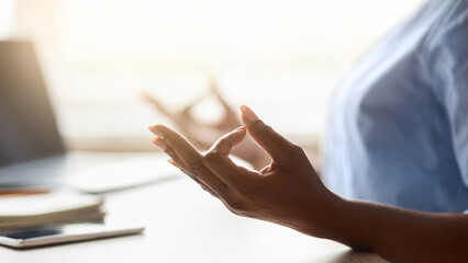 Work Zen. Unrecognizable Black Woman Meditating At Workplace, Closeup Of Female Hands Making Mudra...