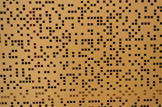 Modern perforated metal wall pattern and outdoor city clock in Luxembourg Geometric perforated metal panels with square cutouts forming a modern wall design. Outdoor city clock tower 