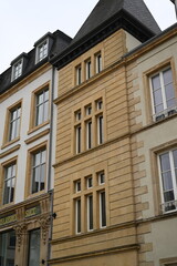 Historic buildings in the old town of Luxembourg City. Elegant European architecture with pastel facades and cobblestone square — peaceful urban scene of cultural heritage.
