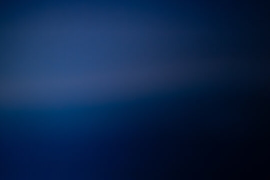 A smooth, rich blue gradient background with soft tonal transitions, creating a minimal and professional atmosphere. Includes copy space.