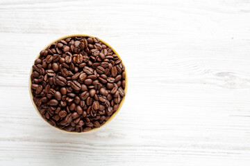 Organic Roasted Coffee Beans in a Bowl, top view. Copy space.