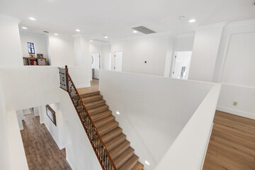 A nicely designed staircase from the second floor of a house