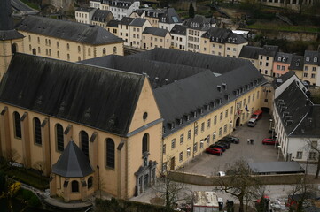 Aerial view of the historic European city center with old buildings, church towers, and green hills. Perfect for travel agencies, tourism marketing, architecture firms, and hospitality branding. The p