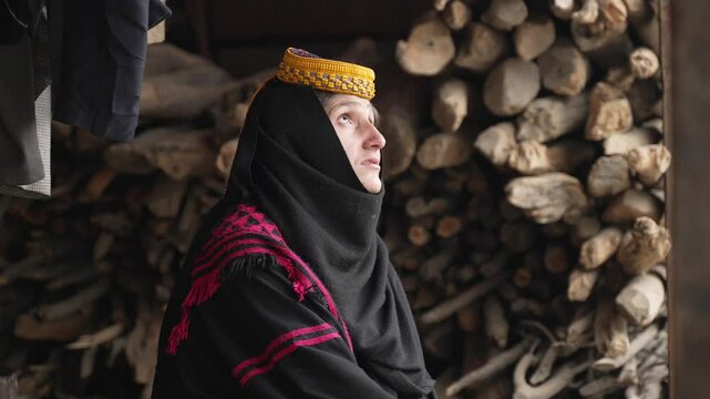Portrait Young Kalashi Woman, Beautiful Traditionally Dressed girl in in Bumburet Valley at Winter, Chitral, Pakistan.