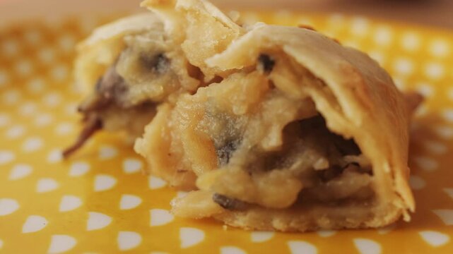Woman eating empanadas argetinian pie, Samosa tart, traditional bakery from argentina, chef filling dough in home with meat and vegetables, homemade spanish empanadas