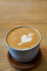 Cup of coffee on a wooden table