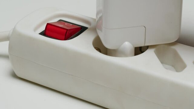 Close up of extension power strip isolated on white, electric filter, safety.