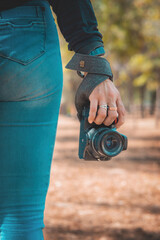 Woman photographer holding a professional camera, world photography day concept, copy space