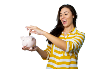 Happy young woman inserting a coin into a piggy bank, isolated on transparent background