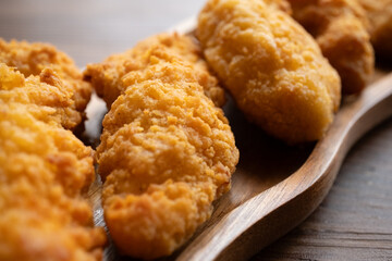 fried chicken in a glass bowl and ketchup