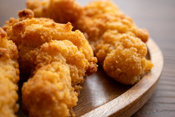 fried chicken in a glass bowl and ketchup