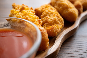 fried chicken in a glass bowl and ketchup