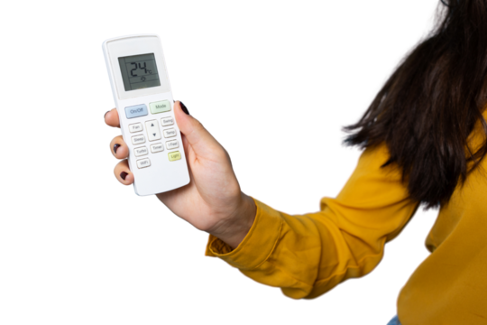 Woman controlling air conditioner remote, lowering temperature setting against transparent backdrop
