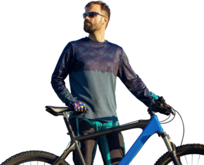 Cyclist in shorts and jersey on a modern carbon hardtail bike with an air suspension fork standing on a cliff against the background of fresh green spring forest