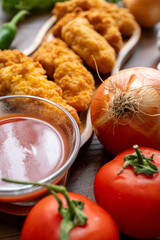 fried chicken in a glass bowl and ketchup
