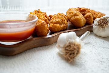 fried chicken in a glass bowl and ketchup