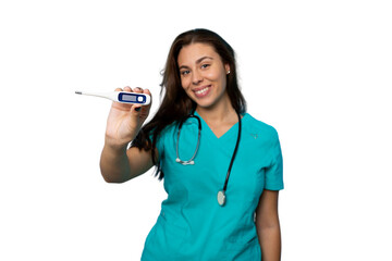Female medical professional in teal uniform displaying digital thermometer against neutral medical...
