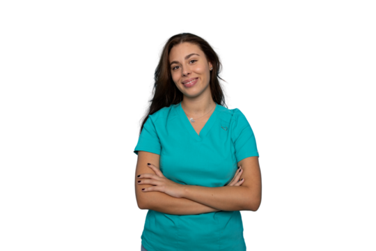 Confident female healthcare worker standing with crossed arms, radiating professionalism and warmth against clean white backdrop